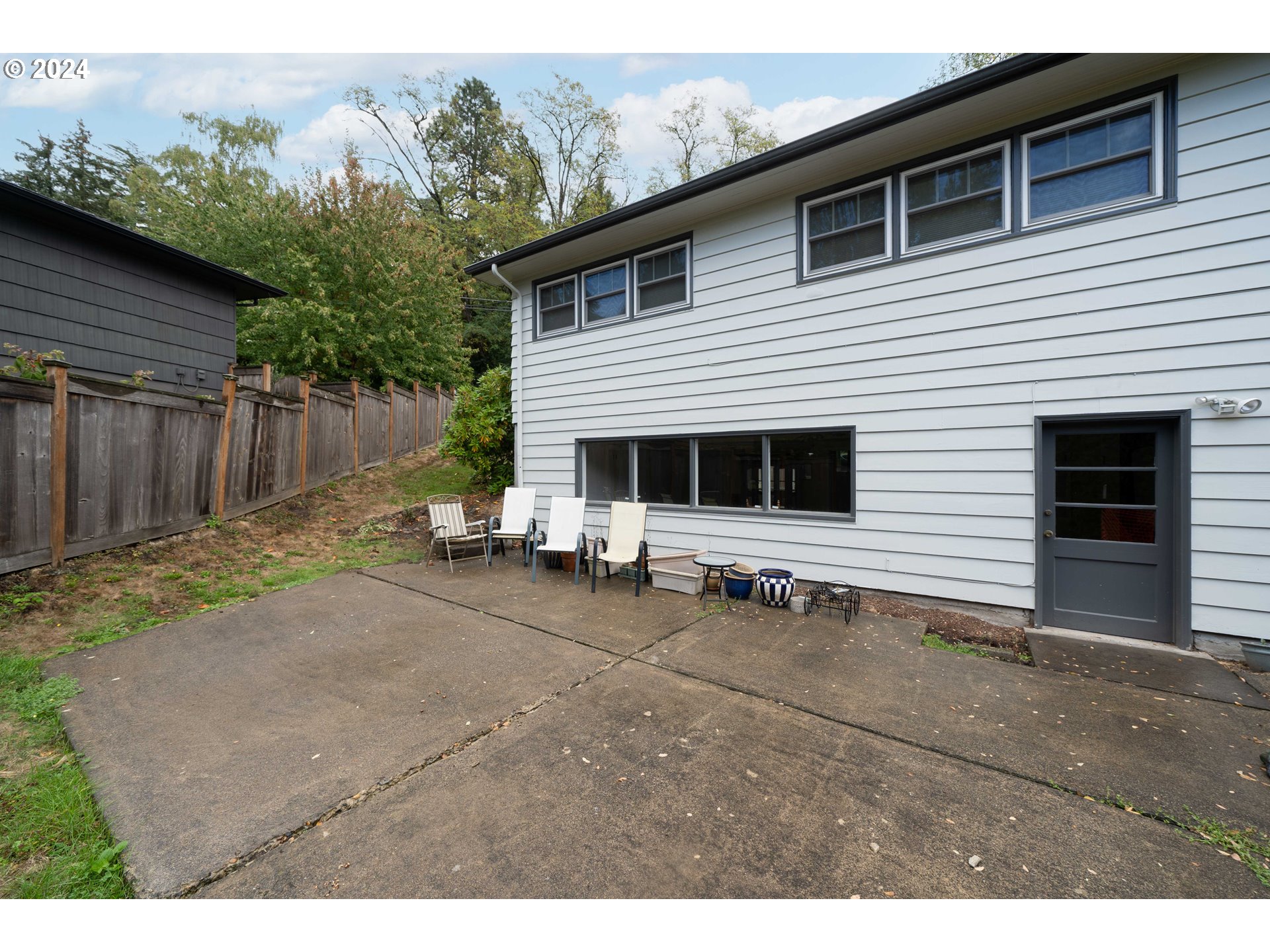 4425 Southwest Dosch Road Portland, OR 97239 - Photo 38 of 40 a view of a house with backyard and sitting area