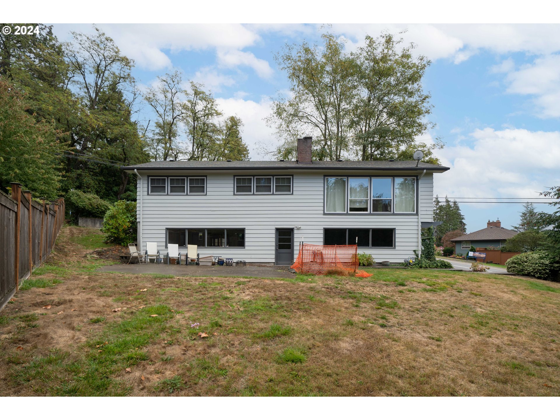 4425 Southwest Dosch Road Portland, OR 97239 - Photo 39 of 40 a view of a house with a yard patio and a tree