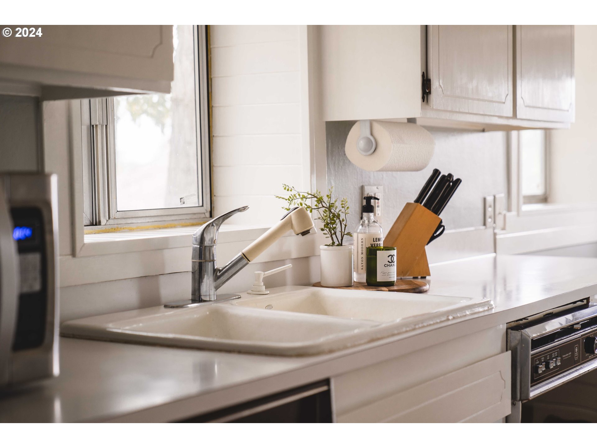 4425 Southwest Dosch Road Portland, OR 97239 - Photo 9 of 40 a kitchen with a sink and a window