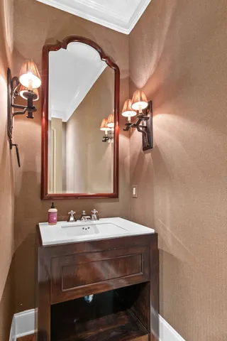 a bathroom with a granite countertop sink a mirror and a shower