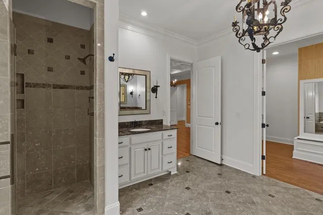 a kitchen with granite countertop a sink and a stove