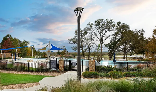 a view of a chairs and table in a patio