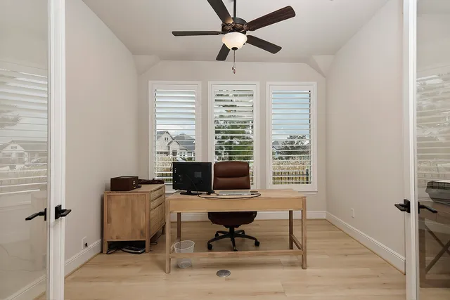 a work room with furniture and windows