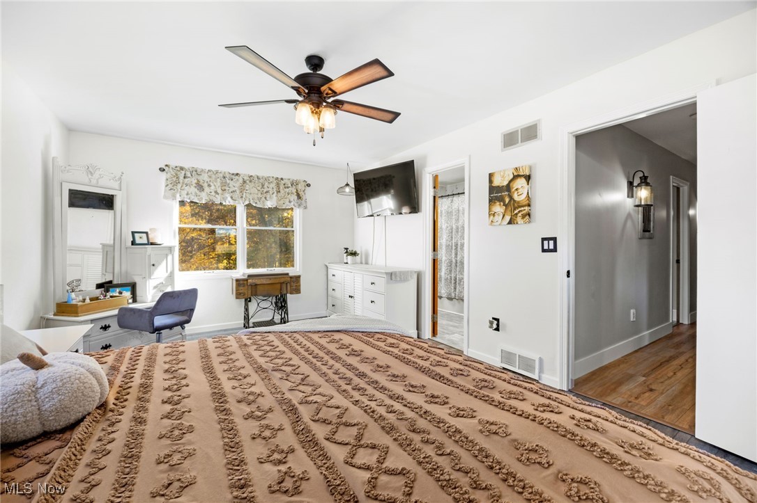 11827 Stratton Road West Salem, OH 44287 - Photo 34 of 47 Bedroom with ceiling fan and wood finished floors