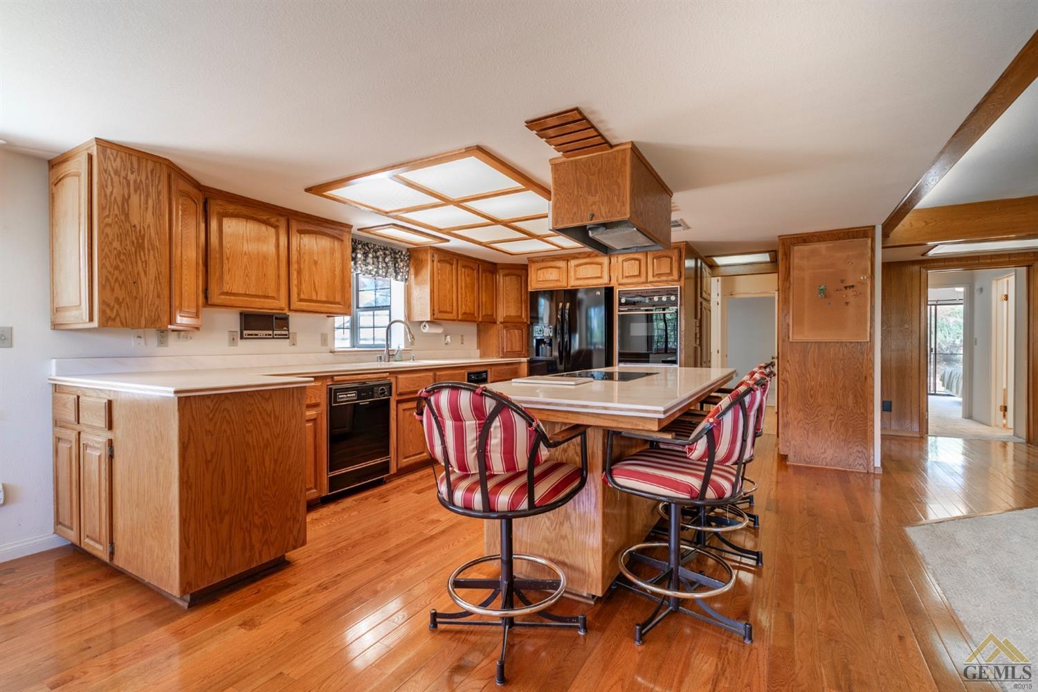Undisclosed Address Tehachapi, CA 93561 - Photo 16 of 44 a view of a dining room with furniture and wooden floor