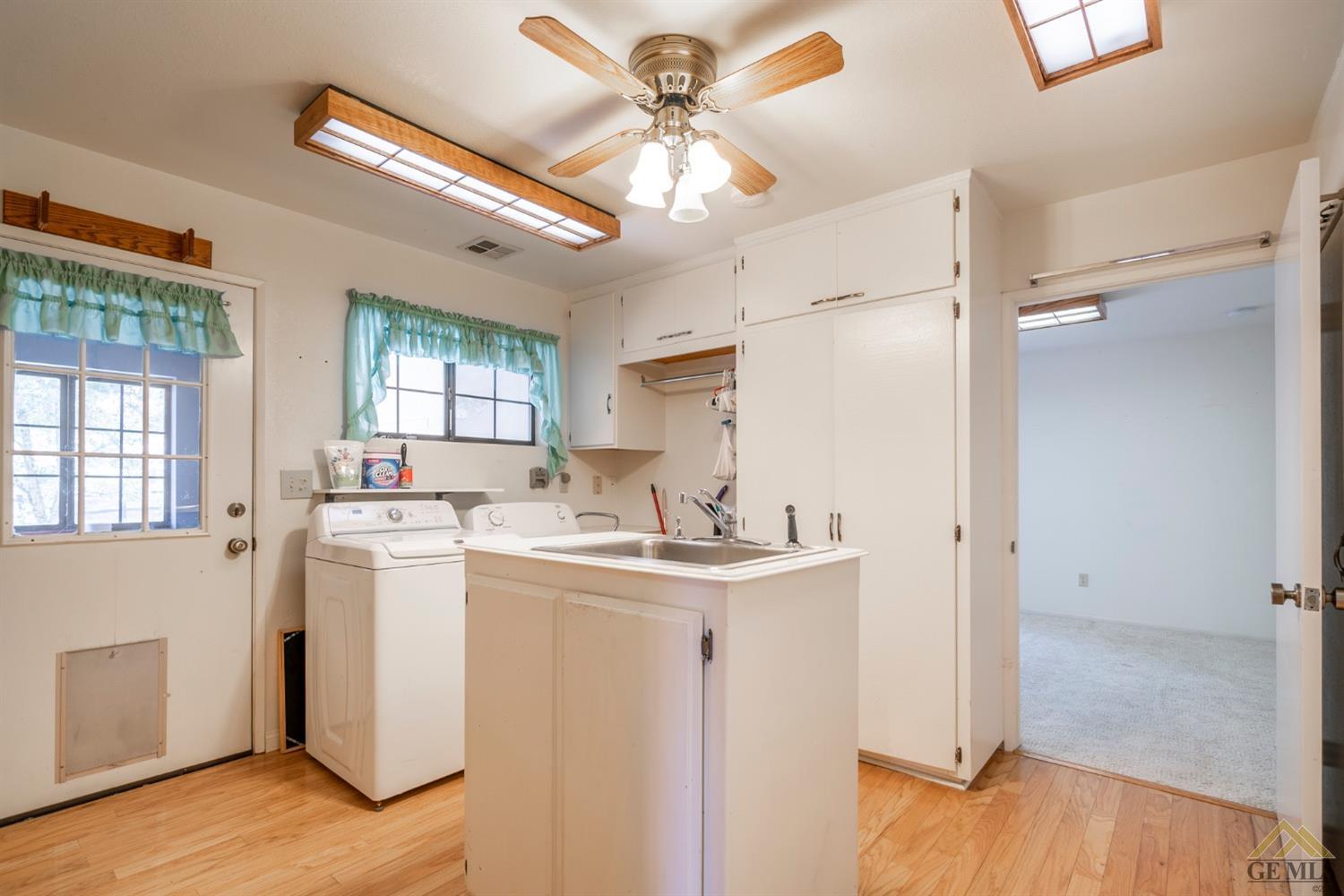 Undisclosed Address Tehachapi, CA 93561 - Photo 19 of 44 a view of a kitchen with a sink appliances and cabinets