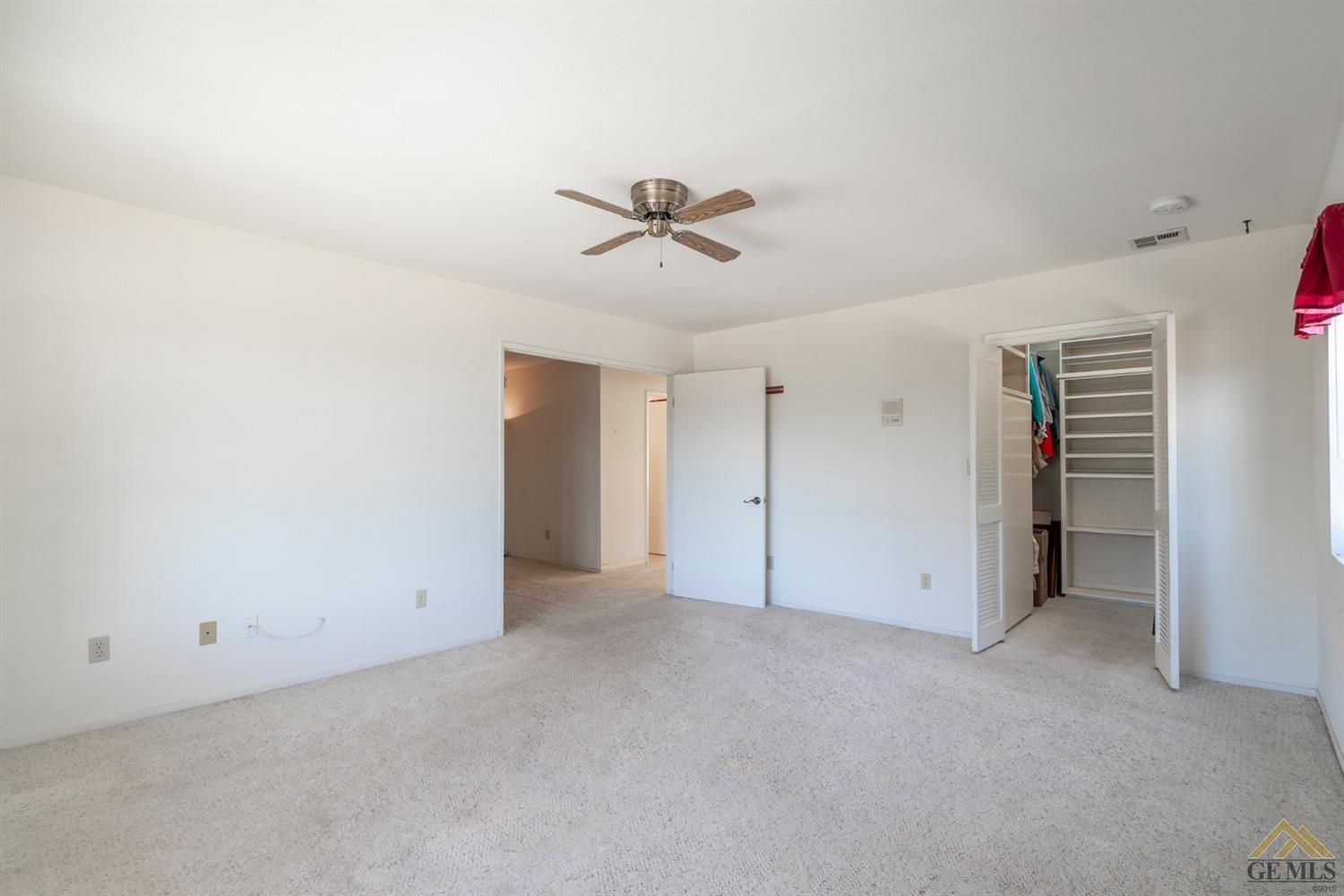Undisclosed Address Tehachapi, CA 93561 - Photo 23 of 44 an empty room with closet and a ceiling fan