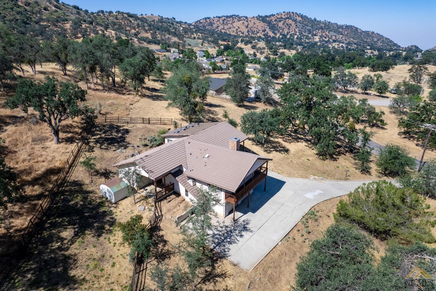 Undisclosed Address Tehachapi, CA 93561 - Photo 3 of 44 an aerial view of a house with a mountain