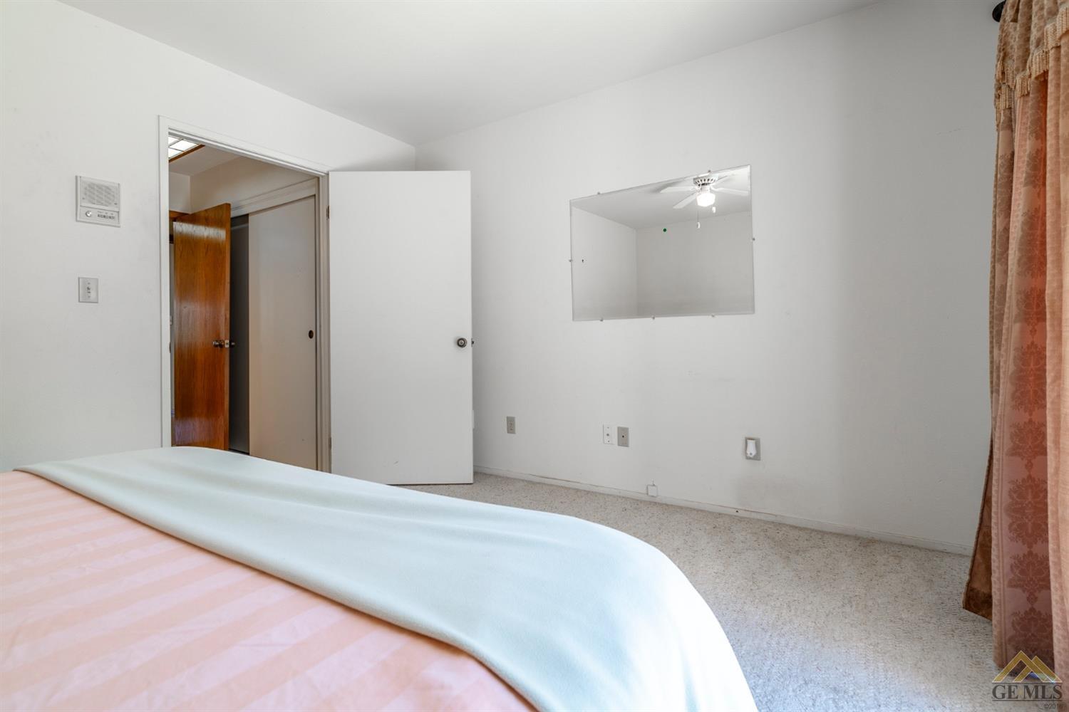 Undisclosed Address Tehachapi, CA 93561 - Photo 35 of 44 a view of a room with closet and mirror