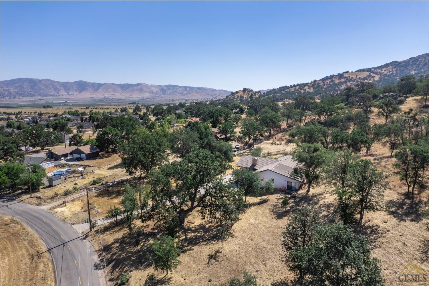Undisclosed Address Tehachapi, CA 93561 - Photo 43 of 44 a view of a lush green field with mountains in the background