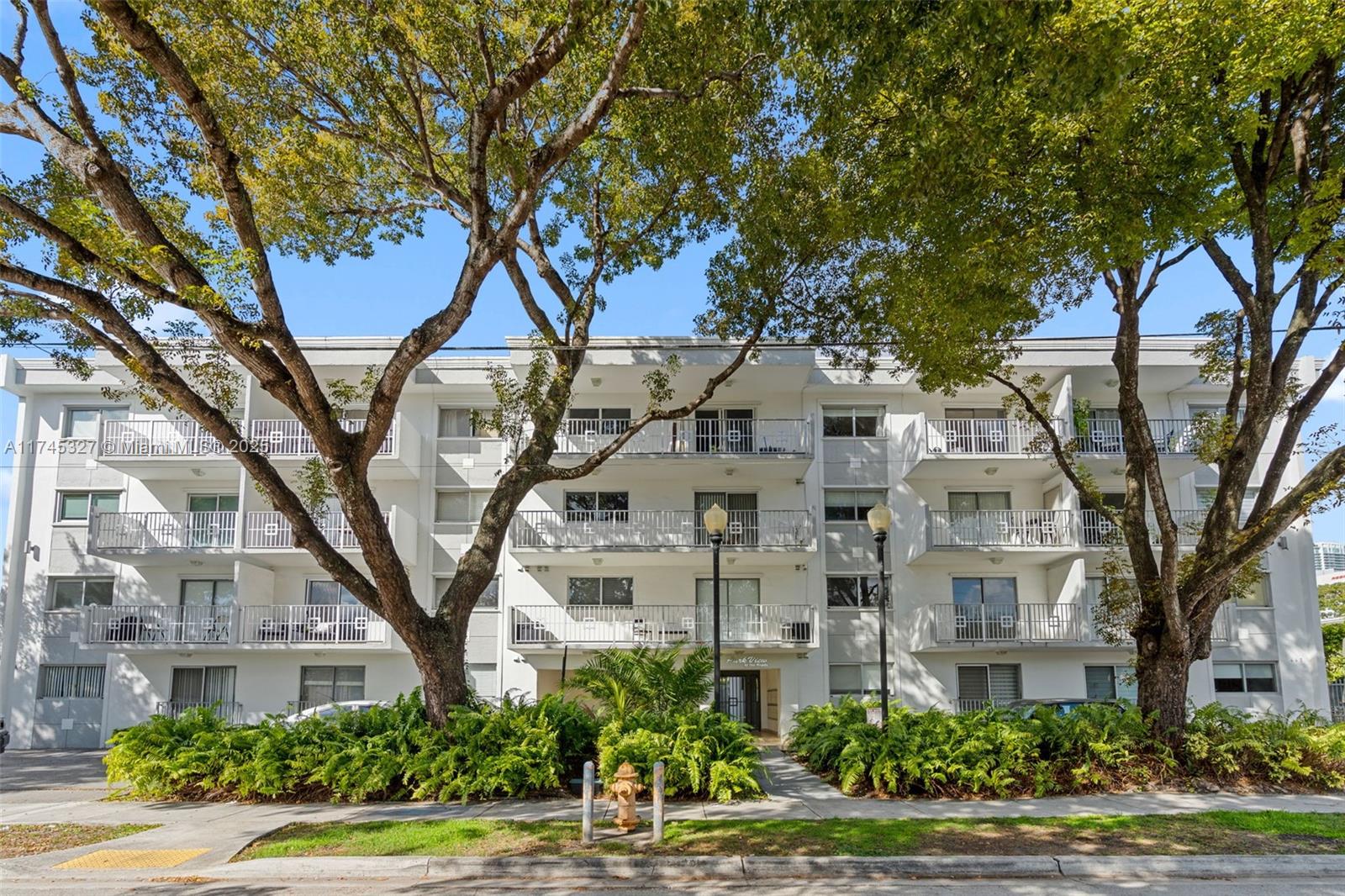 a large building with trees in front of it