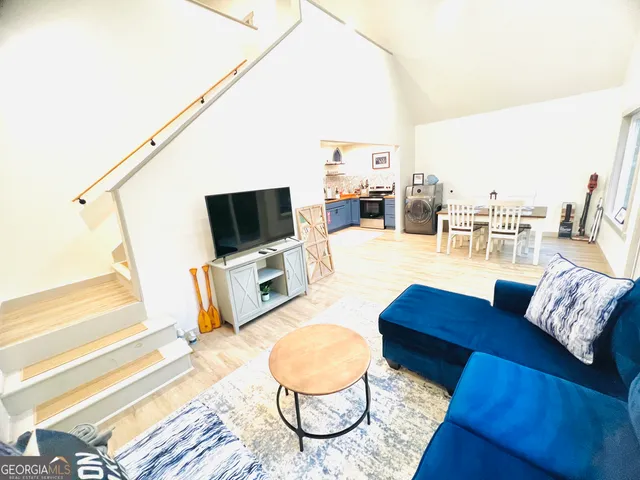 a living room with furniture and a flat screen tv