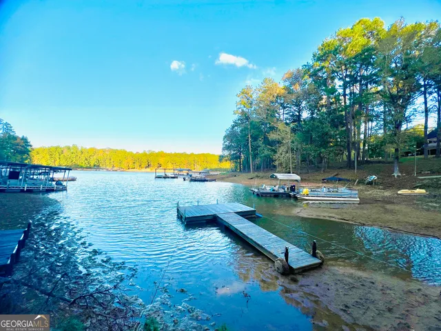 swimming pool with outdoor seating and yard