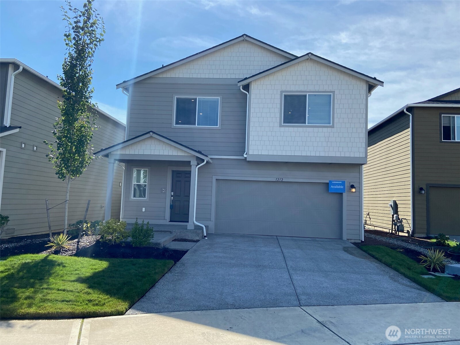 1212 15th Avenue Sultan, WA 98294 - Photo 1 of 19 a front view of a house with a yard and garage