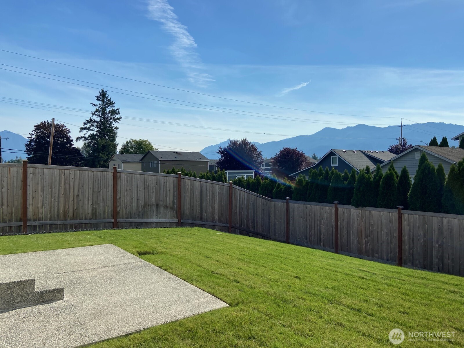 1212 15th Avenue Sultan, WA 98294 - Photo 19 of 19 a view of a backyard with wooden fence