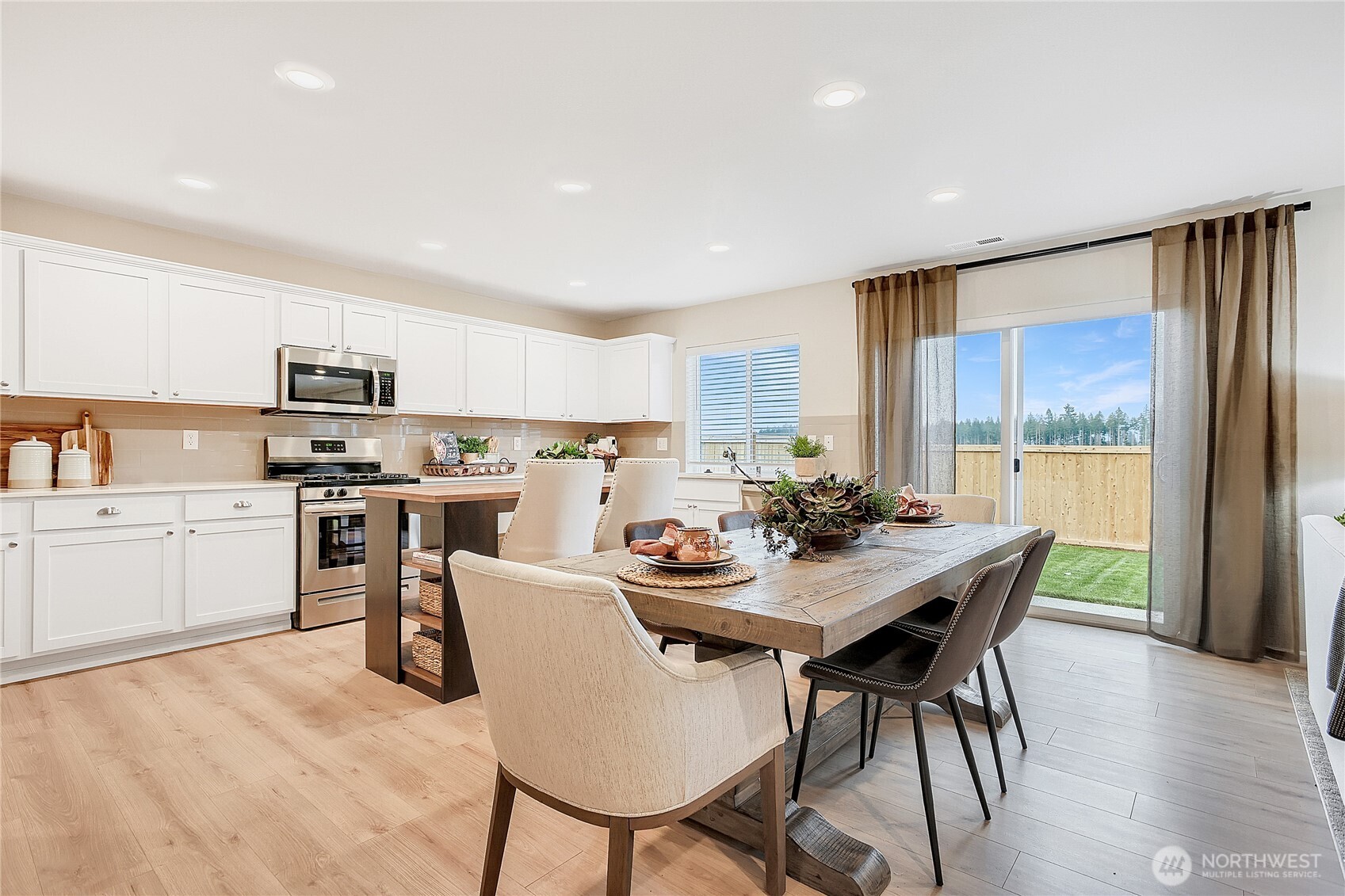 1212 15th Avenue Sultan, WA 98294 - Photo 4 of 19 a kitchen with a table and chairs in it