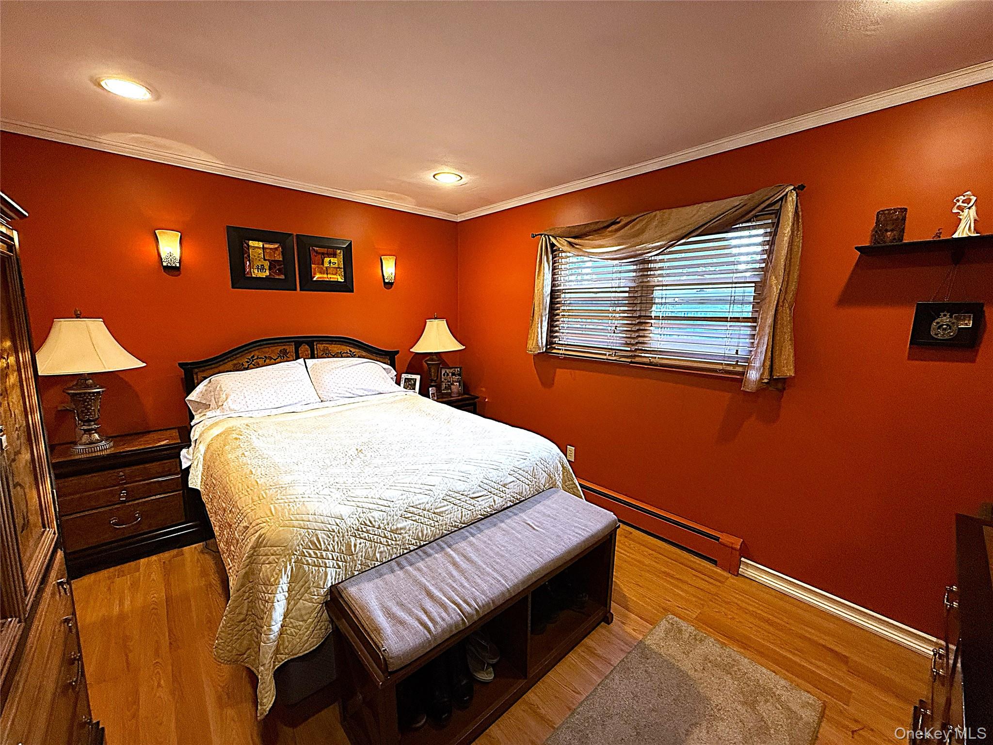 1 Heston Road Shirley, NY 11967 - Photo 19 of 32 Room featuring wood-finish flooring, crown molding, and recessed lighting