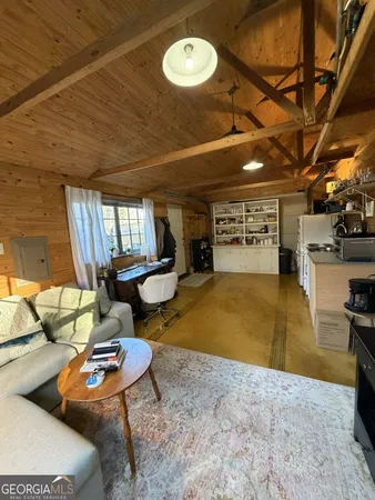 a room with furniture and a flat screen tv