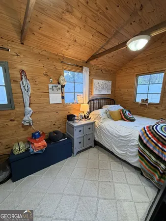 a bed room with a bed and a book shelf