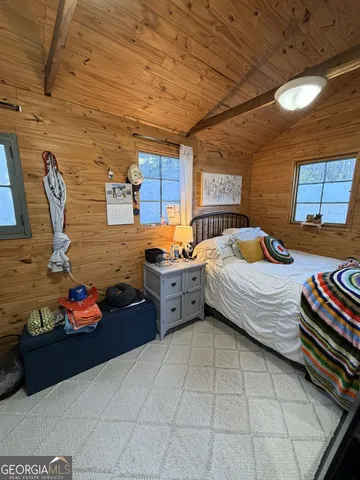 a bed room with a bed and a book shelf