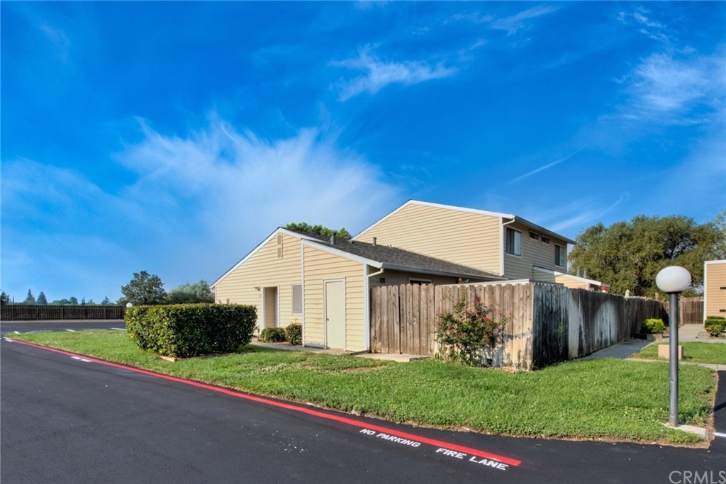 631 North Street Corning, CA 96021 - Photo 14 of 45 a front view of a house with a yard and garage
