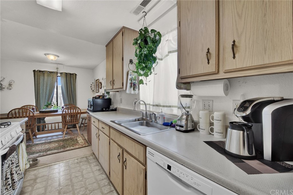 631 North Street Corning, CA 96021 - Photo 18 of 45 a kitchen with stainless steel appliances granite countertop a sink a stove and cabinets