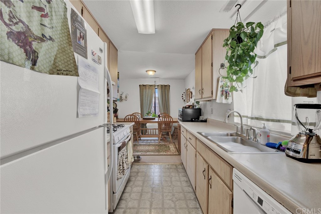 631 North Street Corning, CA 96021 - Photo 19 of 45 a kitchen with a sink and a refrigerator