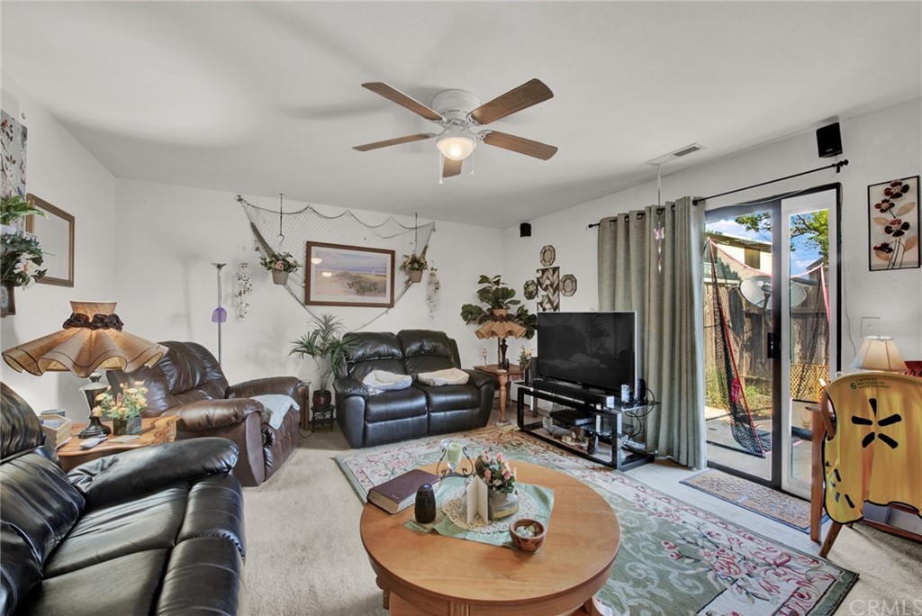 631 North Street Corning, CA 96021 - Photo 30 of 45 a living room with furniture and a flat screen tv