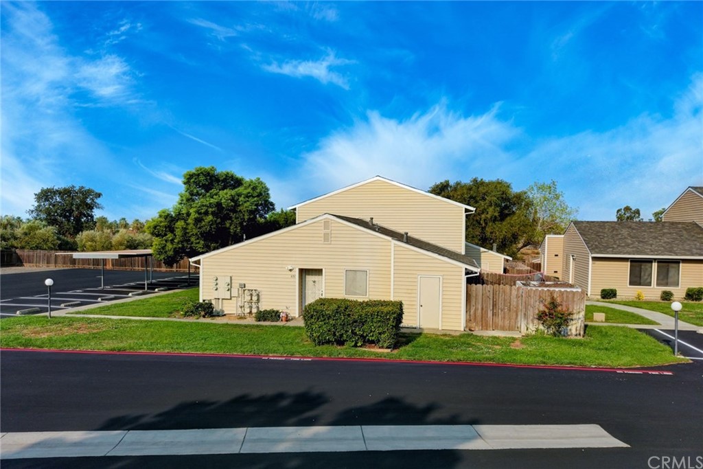 631 North Street Corning, CA 96021 - Photo 3 of 45 a view of a white house with a yard and plants