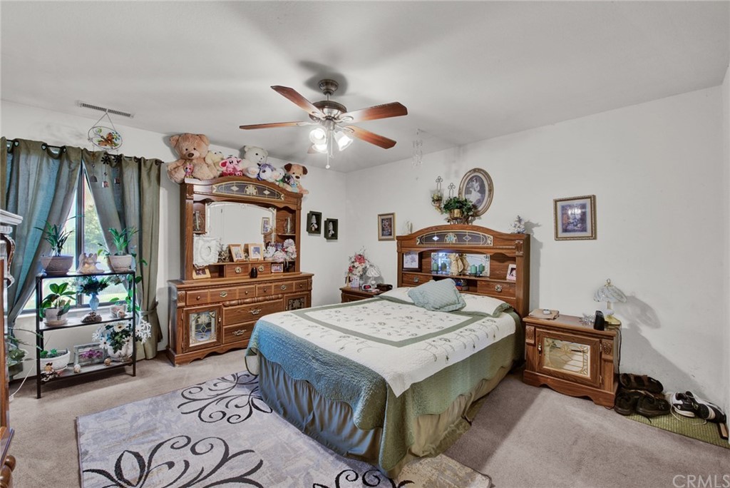 631 North Street Corning, CA 96021 - Photo 34 of 45 a living room with furniture and a flat screen tv