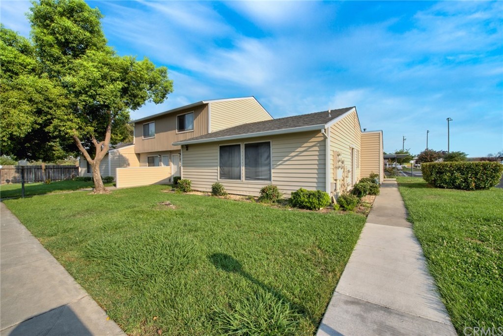631 North Street Corning, CA 96021 - Photo 10 of 45 a front view of a house with a yard