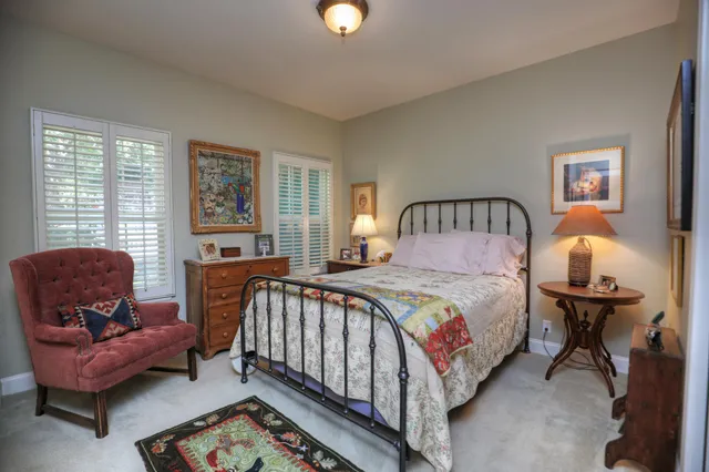 a bathroom with a sink a vanity a mirror and a bathtub