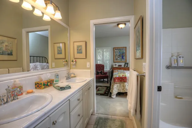 a bedroom with a bed and chair