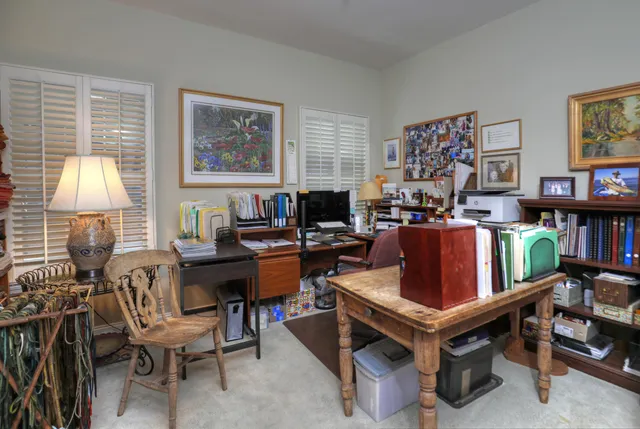 a bathroom with a tub a sink and a large mirror