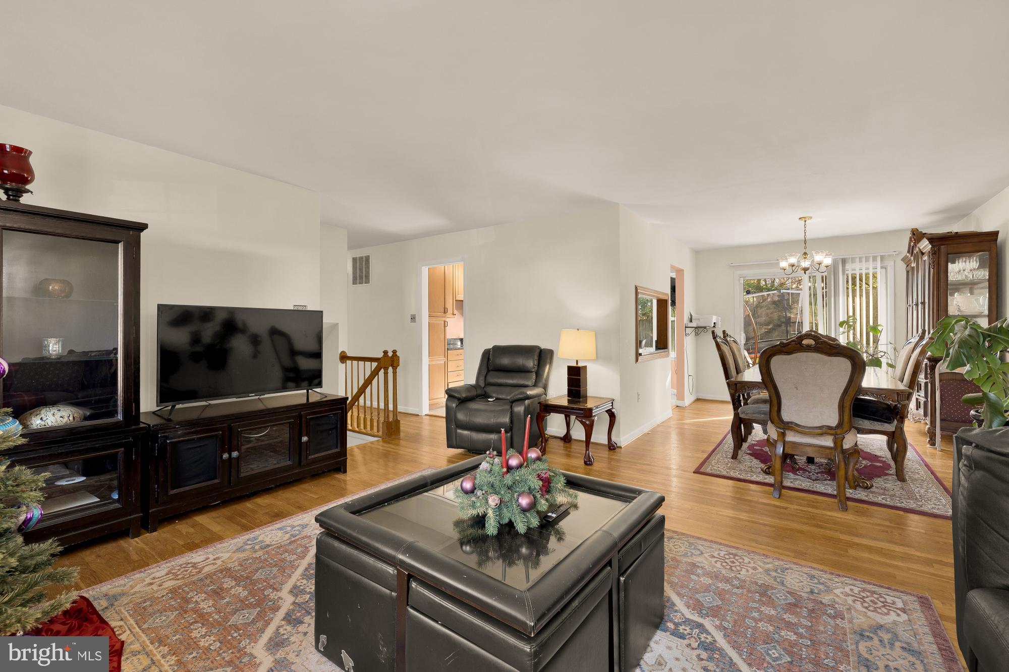 1513 Menlee Drive Silver Spring, MD 20904 - Photo 2 of 19 a living room with furniture and a flat screen tv
