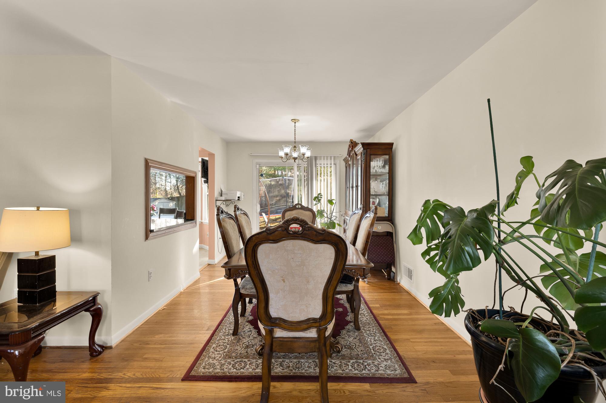 1513 Menlee Drive Silver Spring, MD 20904 - Photo 3 of 19 a view of a dining room with furniture a rug and wooden floor