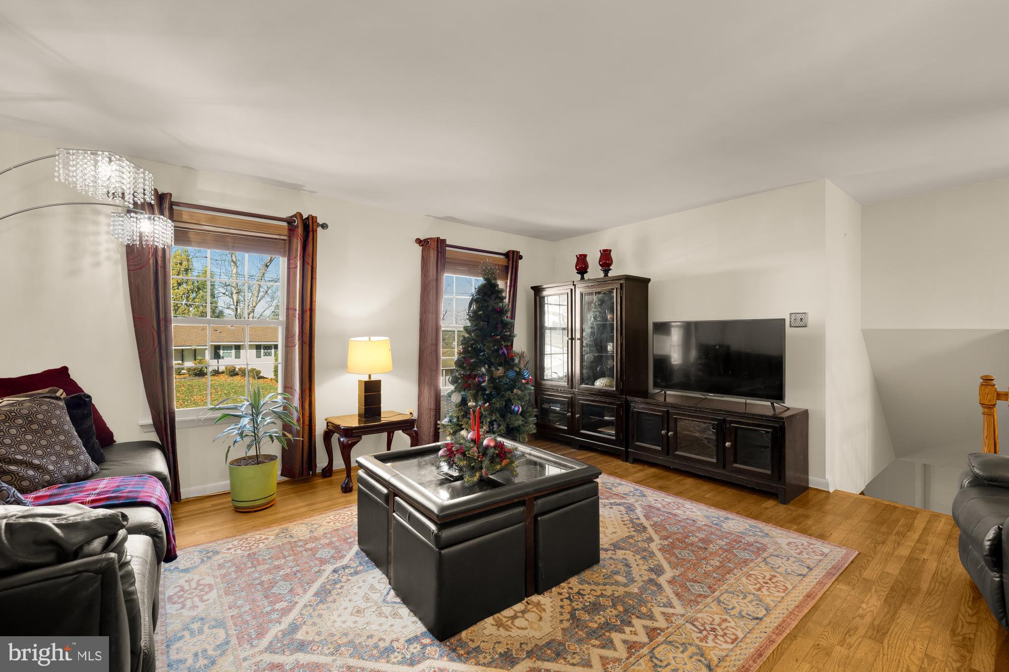 1513 Menlee Drive Silver Spring, MD 20904 - Photo 6 of 19 a living room with furniture and a flat screen tv