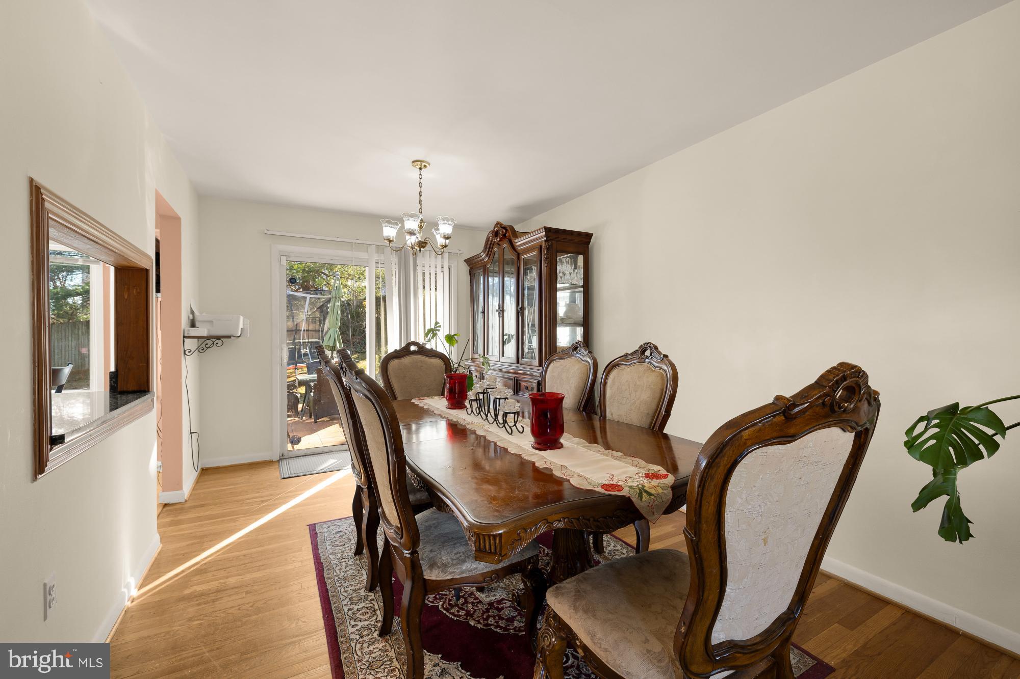 1513 Menlee Drive Silver Spring, MD 20904 - Photo 7 of 19 a view of a dining room with furniture and chandelier