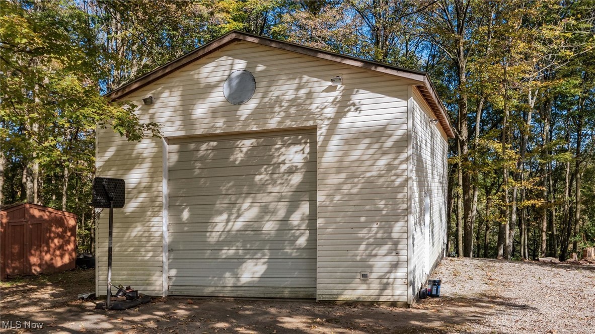 13306 Fairview Road Southeast Newark, OH 43056 - Photo 47 of 48 View of home's exterior featuring a storage unit