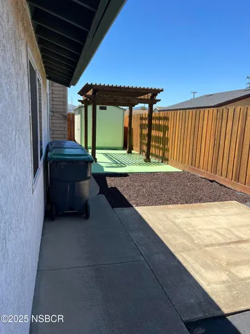 a view of backyard with cabin