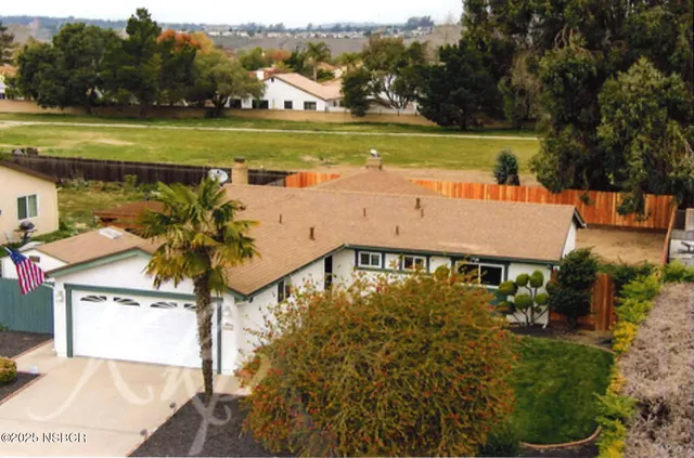 a view of a swimming pool with an outdoor space and seating area