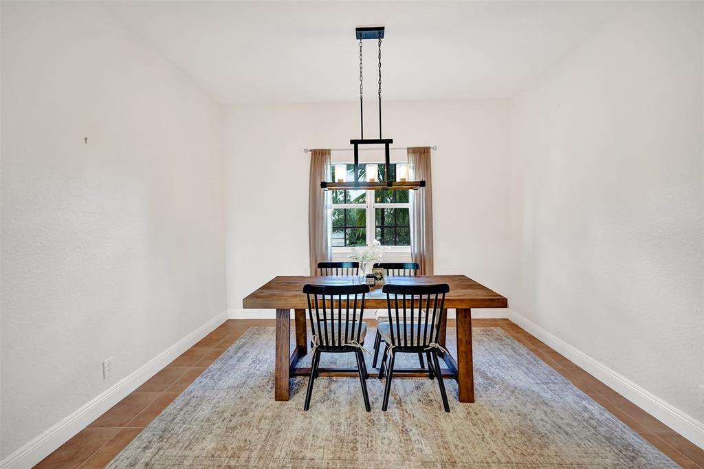 228 Southwest 6th Court Pompano Beach, FL 33060 - Photo 11 of 50 a view of a room with a table and chairs