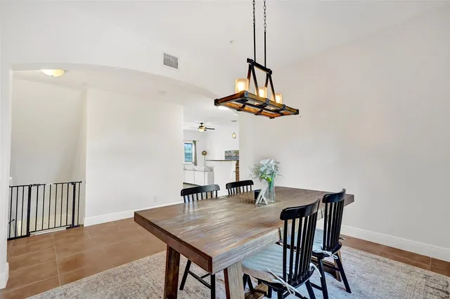 a view of a dining room furniture and chandelier