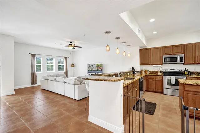 a kitchen with a sink cabinets and window