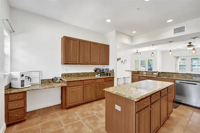 a kitchen with a sink stove and wooden cabinets