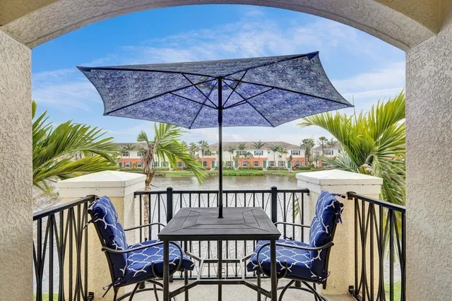 a view of a balcony with furniture