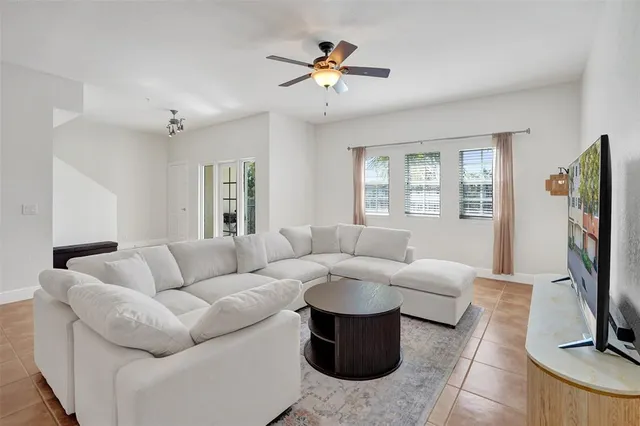 a living room with furniture fireplace and a flat screen tv