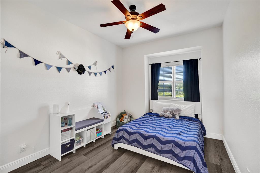 228 Southwest 6th Court Pompano Beach, FL 33060 - Photo 36 of 50 a bedroom with a bed and a window