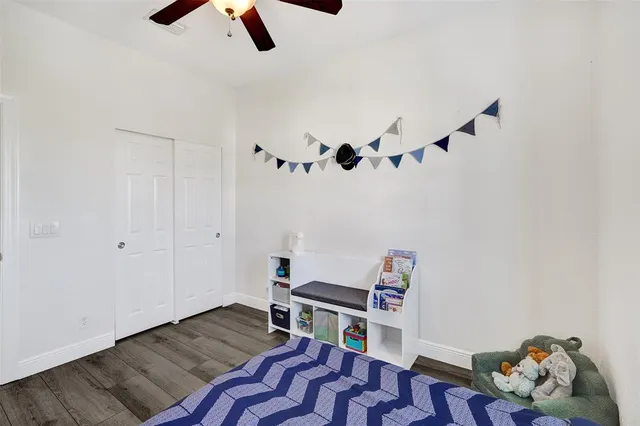 a bedroom with furniture and window