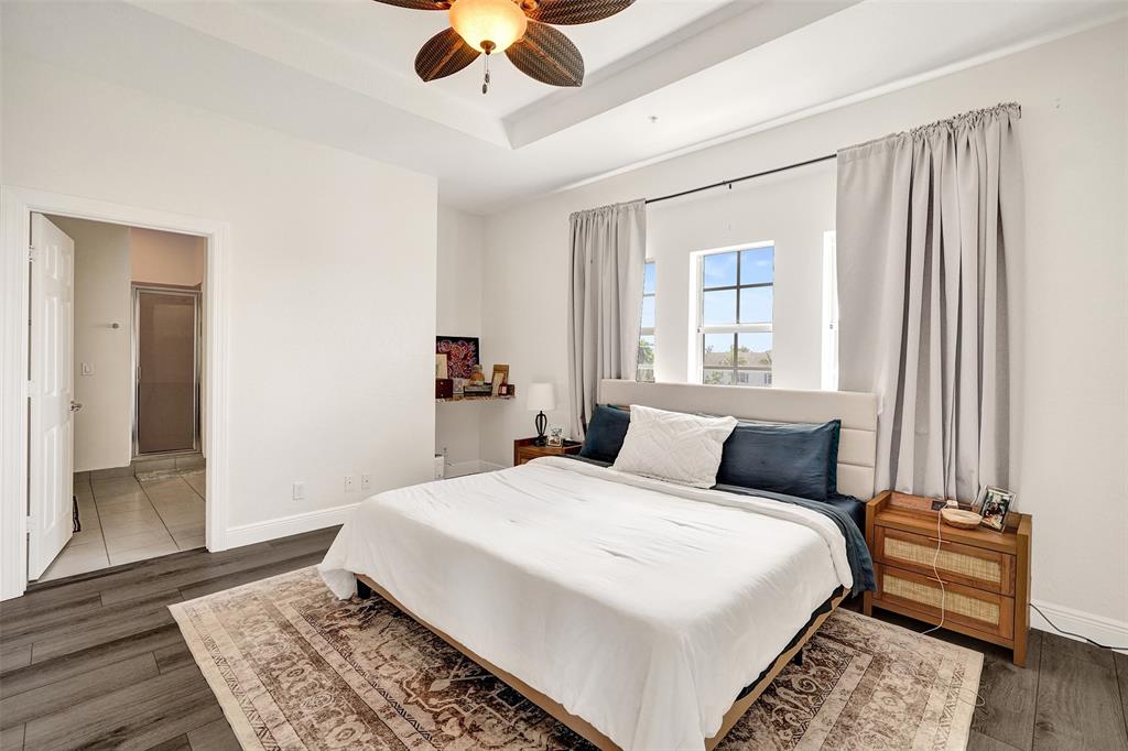 228 Southwest 6th Court Pompano Beach, FL 33060 - Photo 39 of 50 a bedroom with a bed and wooden floor